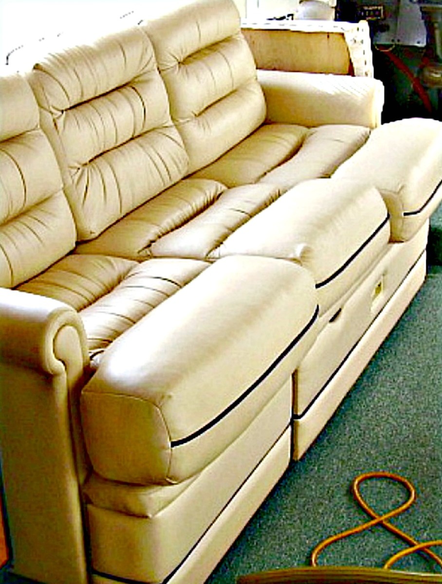 This sofa converts to a bed and also has pull out storage beneath the seat.