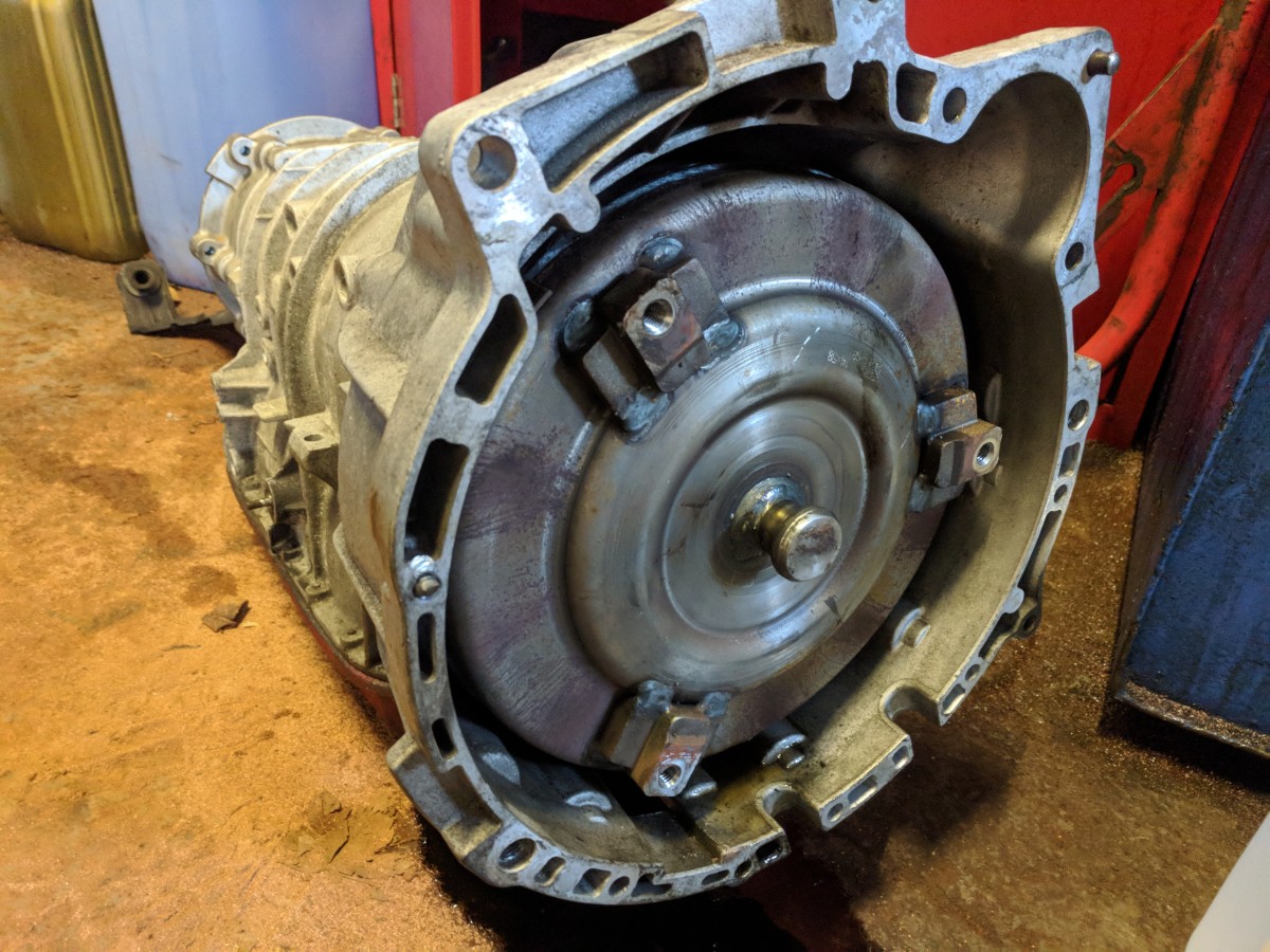 A GM5L40E transmission with torque converter seated in the bellhousing. This model of transmission is fitted to a number of different models of vehicle.