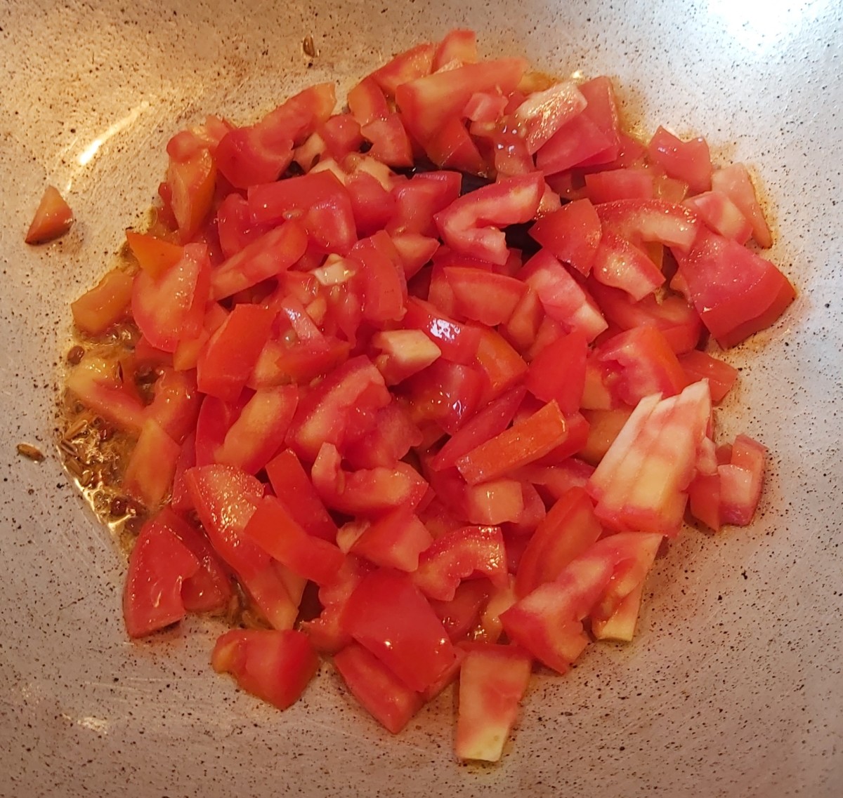 Add finely chopped tomatoes and salt to taste.