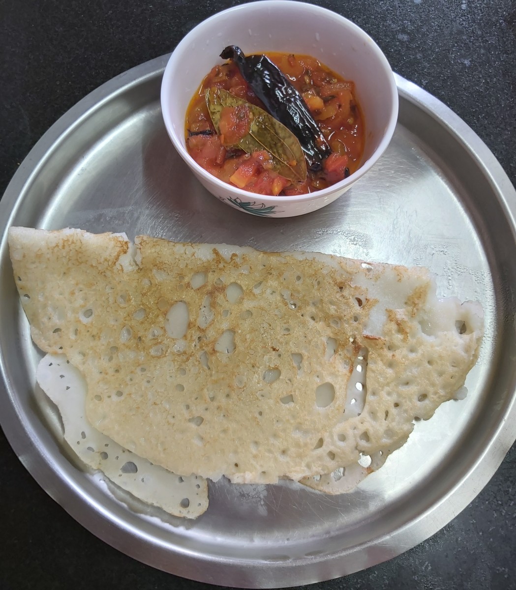 Ladle the tomato chutney into a serving bowl. Serve hot with dosa, paratha or snacks and enjoy.