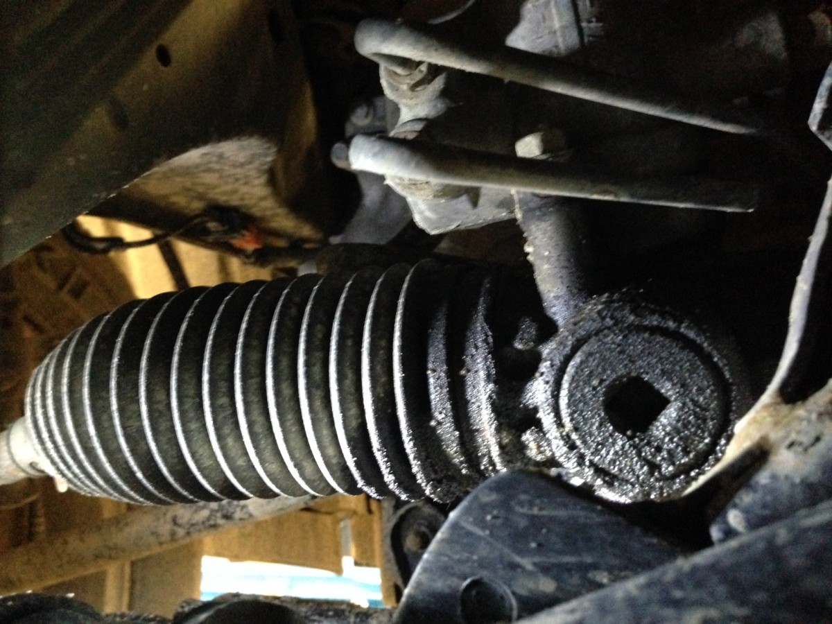 Another view of a leaking steering rack end seal, starting to seep through the boot. 