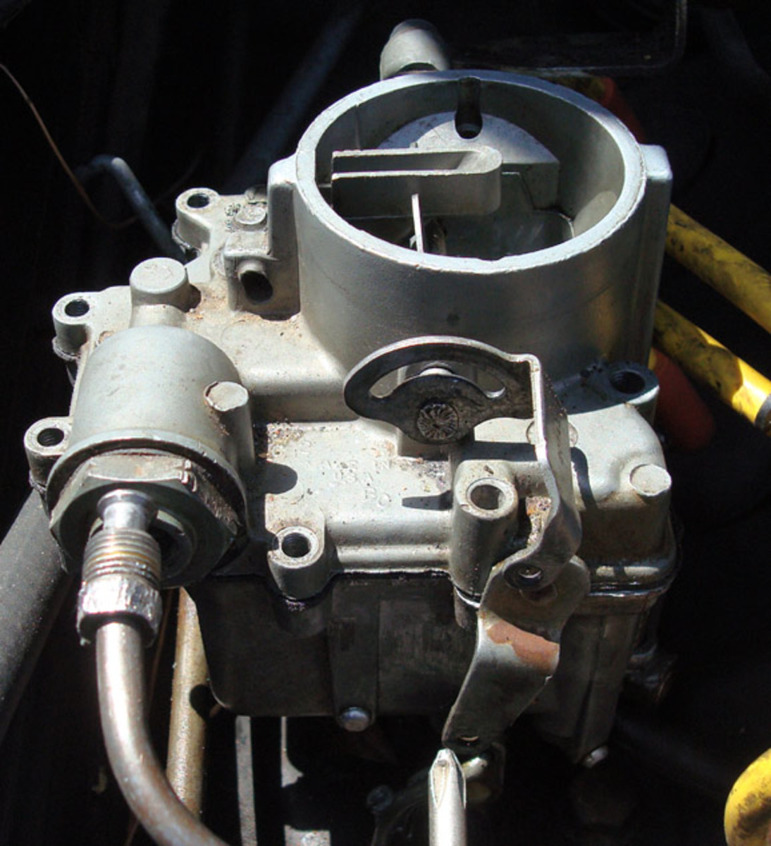 Once cleaned, reinstall the cluster back into the carb as you found it