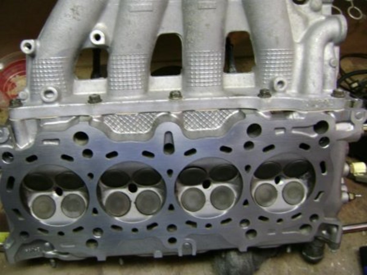 Cylinder head with intake manifold attached. 