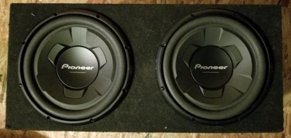 A pair of Pioneer TSW126M subwoofers in a sealed box. 