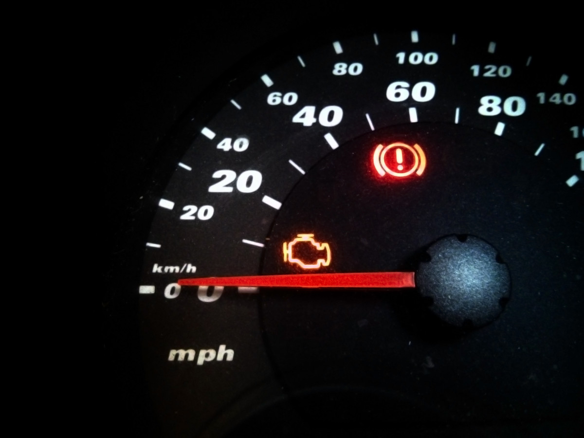 "Check Engine" light (yellow motor icon) on dashboard