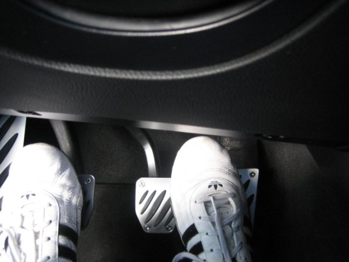 In a car with manual transmission, you will use both feet to work the pedals: left foot works the clutch, right foot works the gas and brake