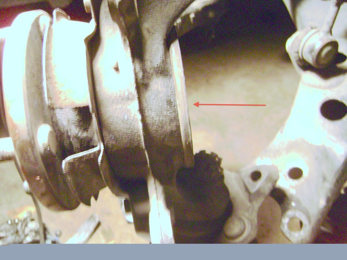 DD.  Move the axle shaft into the steering knuckle