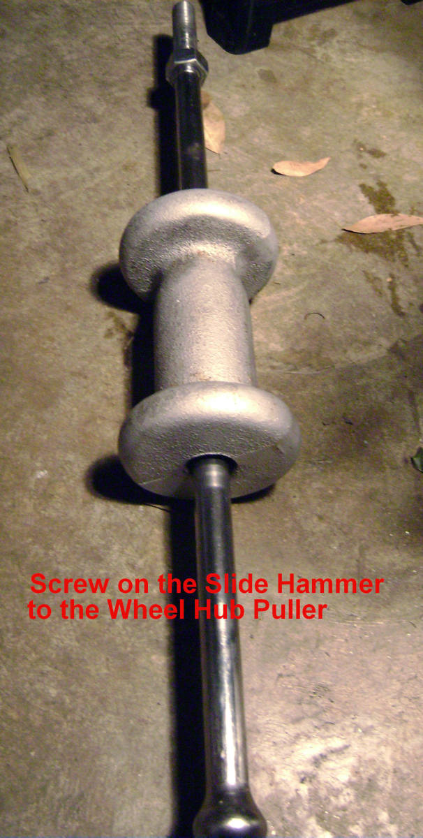 I.  Screw the slide hammer onto the hub puller tool