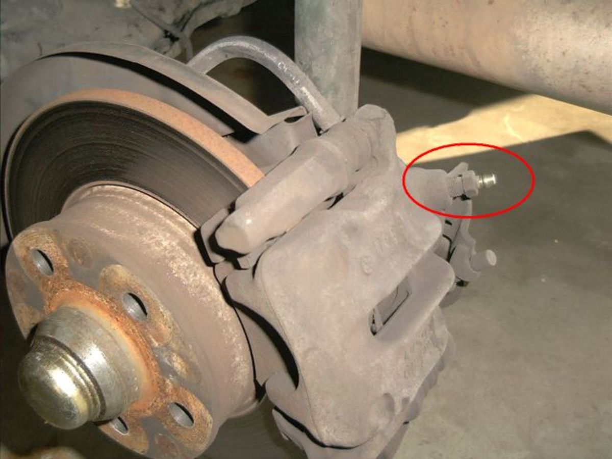 Connect your vacuum pump to the bleeder screw on the caliper or wheel cylinder.