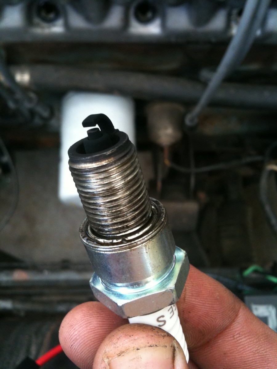 A fouled spark plug can cause a rough idle.