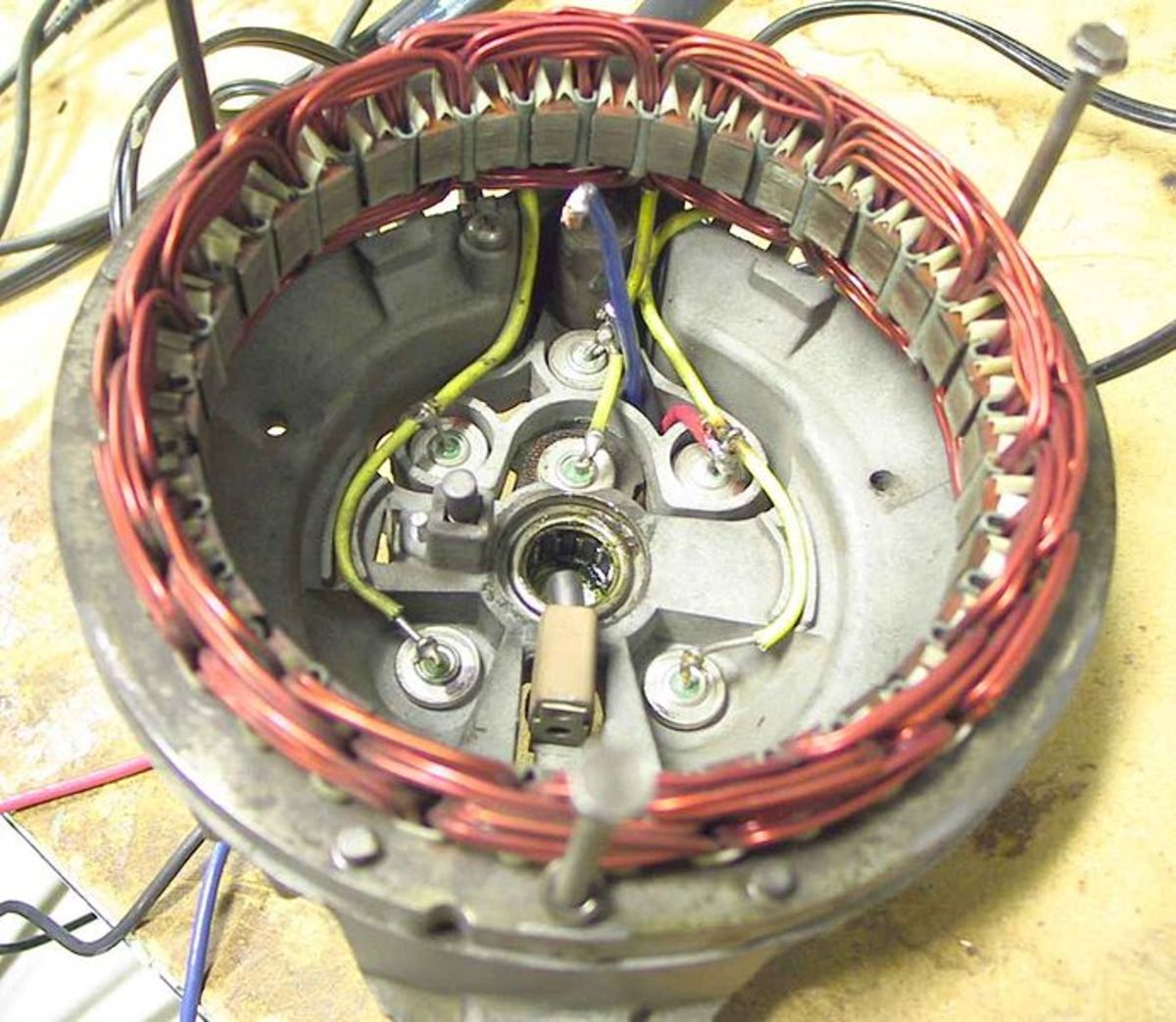 Alternator diodes (connected to the yellow wires) allow current to flow in one direction.