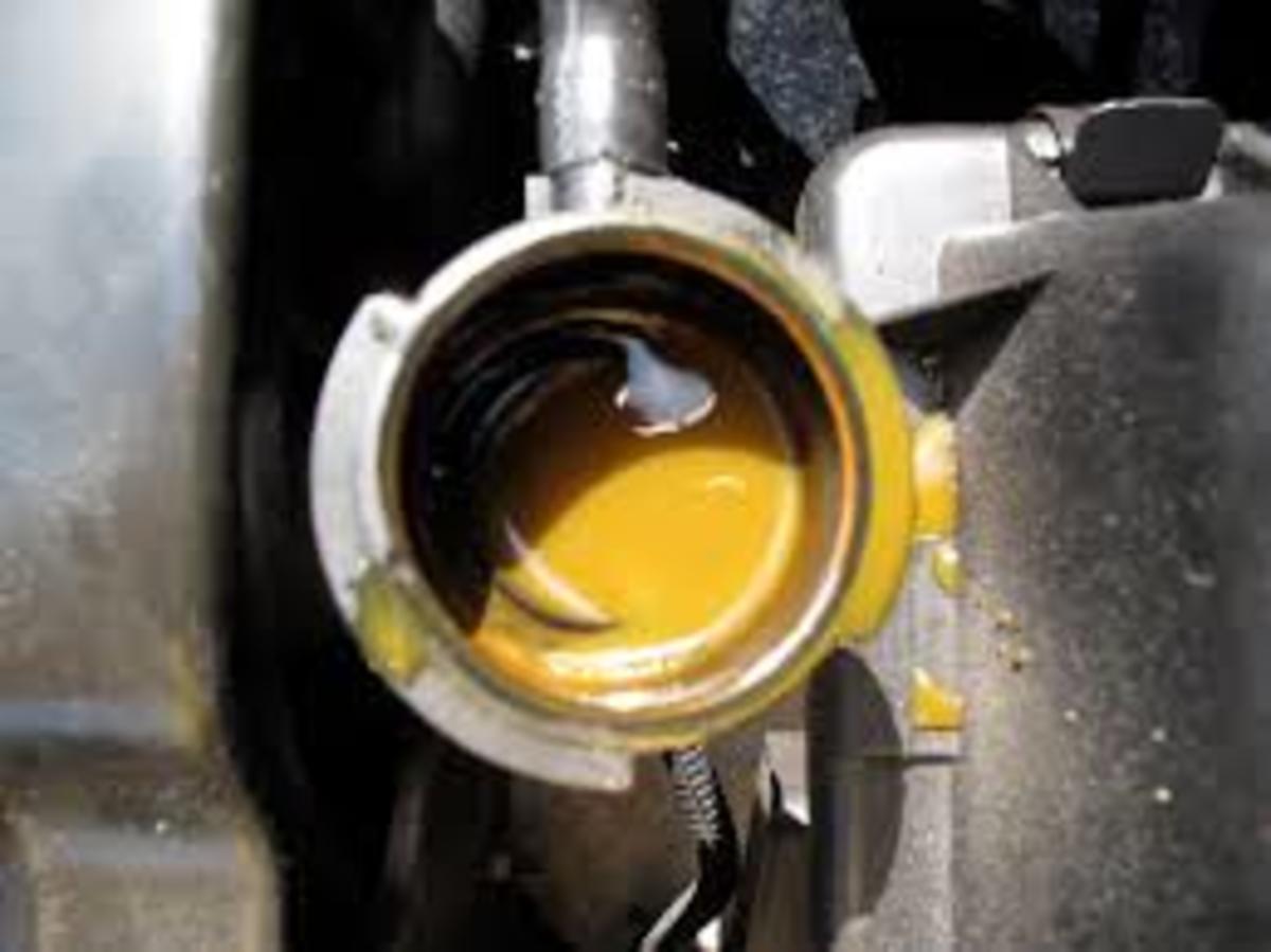 Common sign of a bad head gasket: Oil mixed with coolant in the radiator.