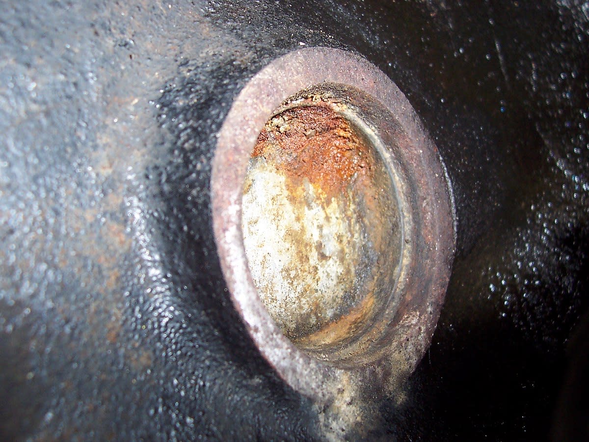Poor cooling system maintenance can cause corrosion and leaks like this one from an engine core plug.