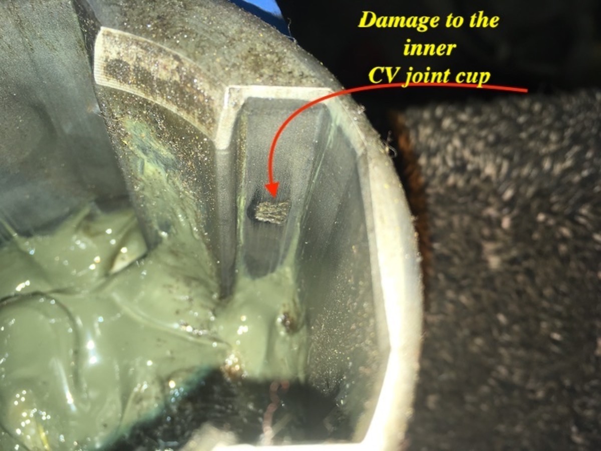 This is the minor damage inside the inner CV joint cup which caused a violent vibration under acceleration. 
