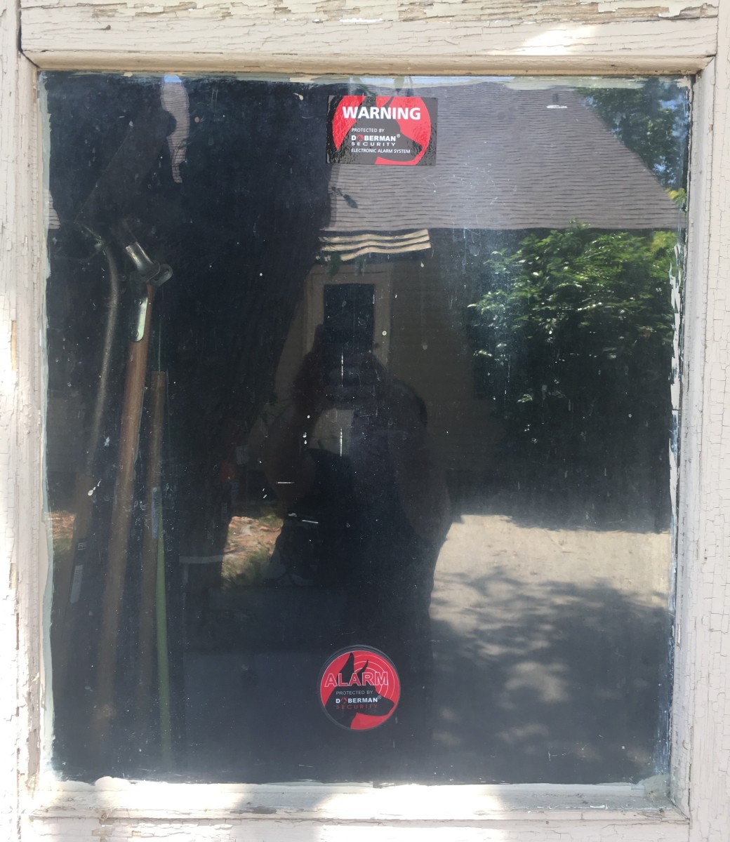 I use a Doberman Security alarm and sticker on my garage door since the garage is detached from my house.