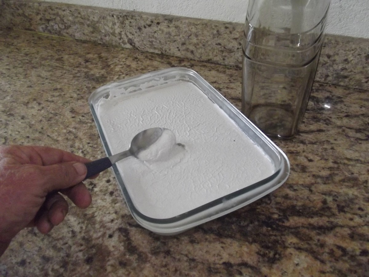 After waiting about a day, the thickened coconut oil can be removed from the container.