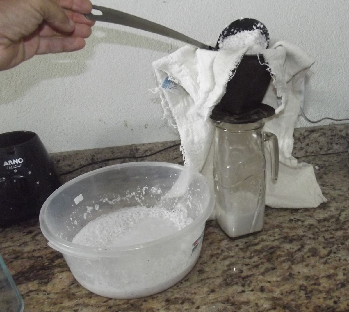 Filter the coconut through a cheesecloth and collect the coconut milk.
