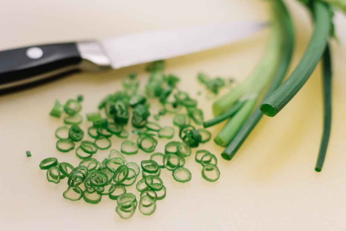 Green onions are easy to grow from scraps, and will produce a steady supply of greens for years after planting.