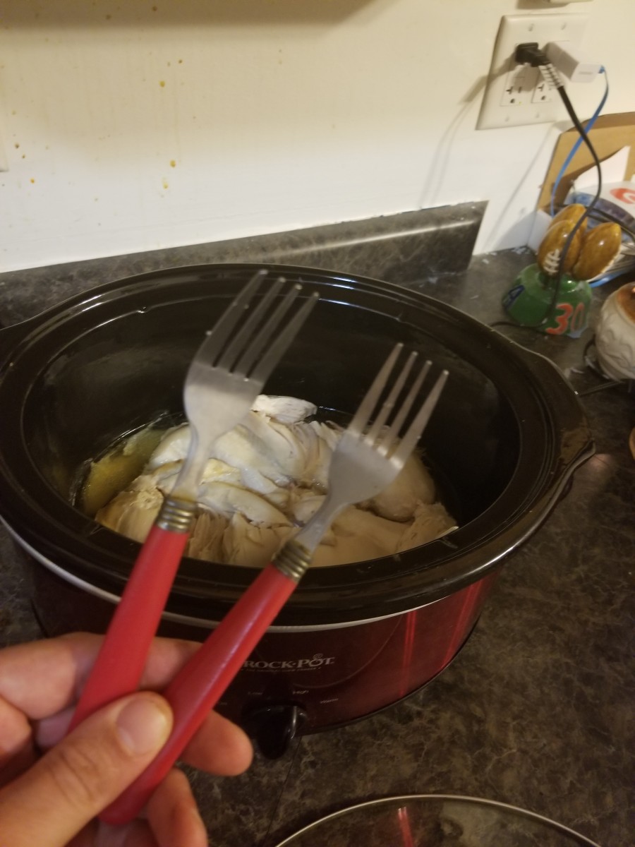 Take a fork in each hand, stick the forks in a chicken breast, and rip it apart.   