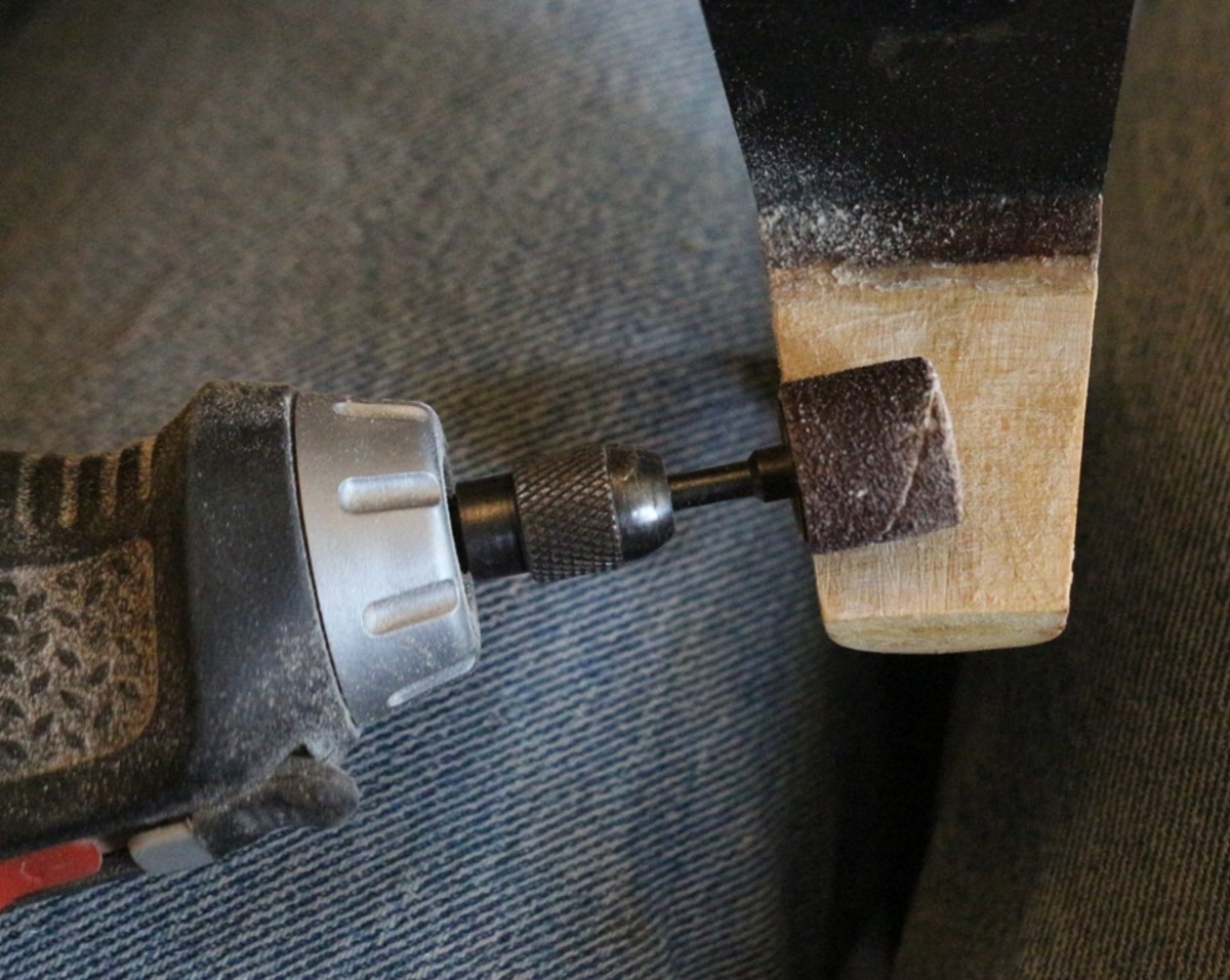 I used a rotary tool with a small sanding drum to gently remove remnants of glue from the neck tenon and body mortise. 