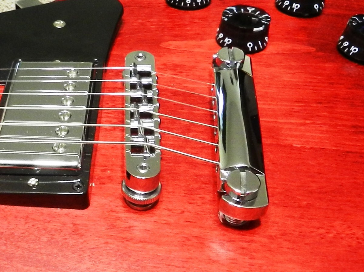 A Tune-o-matic bridge with stop-bar tailpiece.