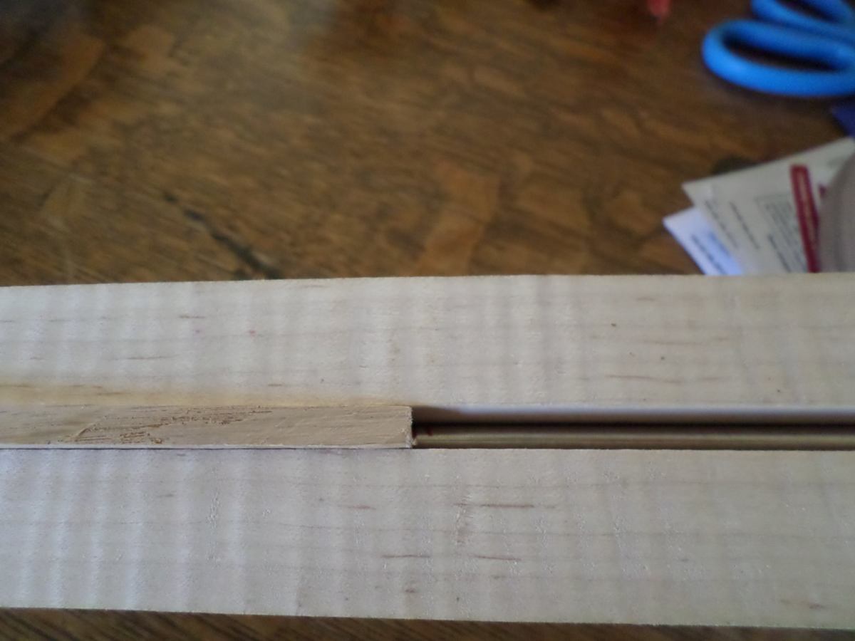 Truss rod and cover strip.