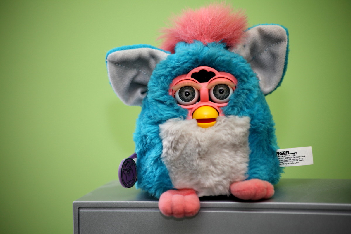 Furbies were the "it" toy to have in 1998–2000.  The Furby looks like a hamster or owl and is a fuzzy robotic toy that speaks Furbish but gradually acquires English over time.