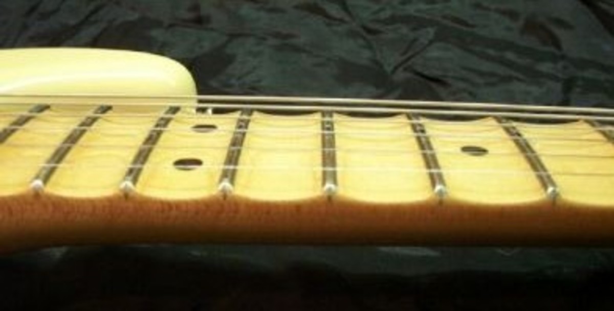 An up close view of the scalloped fingerboard on a Fender Yngwie Malmsteen Stratocaster