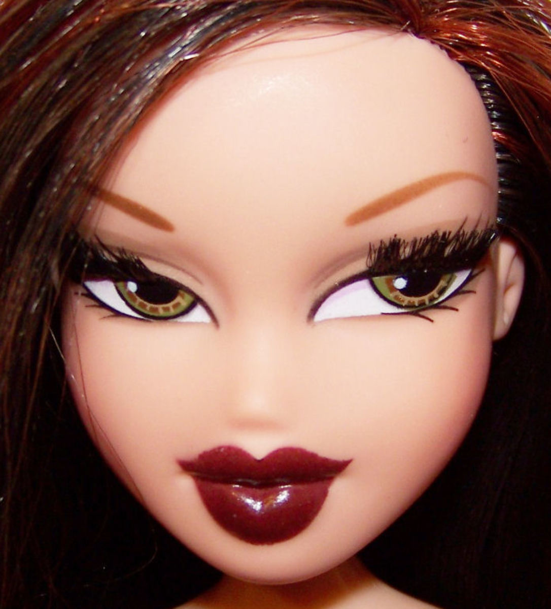 Bratz fashion dolls were introduced in 2001.  The toys featured full, lush lips with lipstick and large, almond-shaped eyes with eyeshadow.  The 10-inch dolls competed with Mattel's Barbie product line and consisted of 40% of the fashion doll market.
