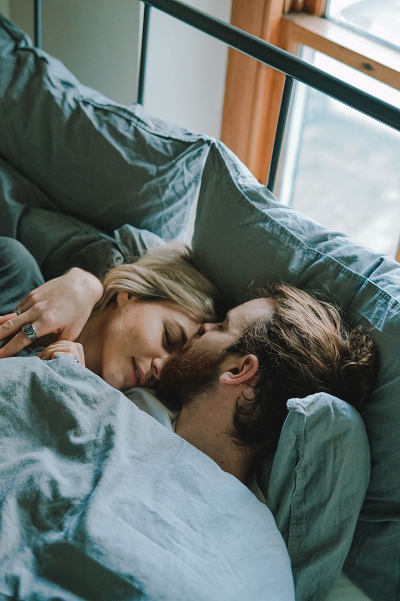 Don't let yourself be fooled—guys love to cuddle just as much as you do! Who doesn't like being little spoon now and then?