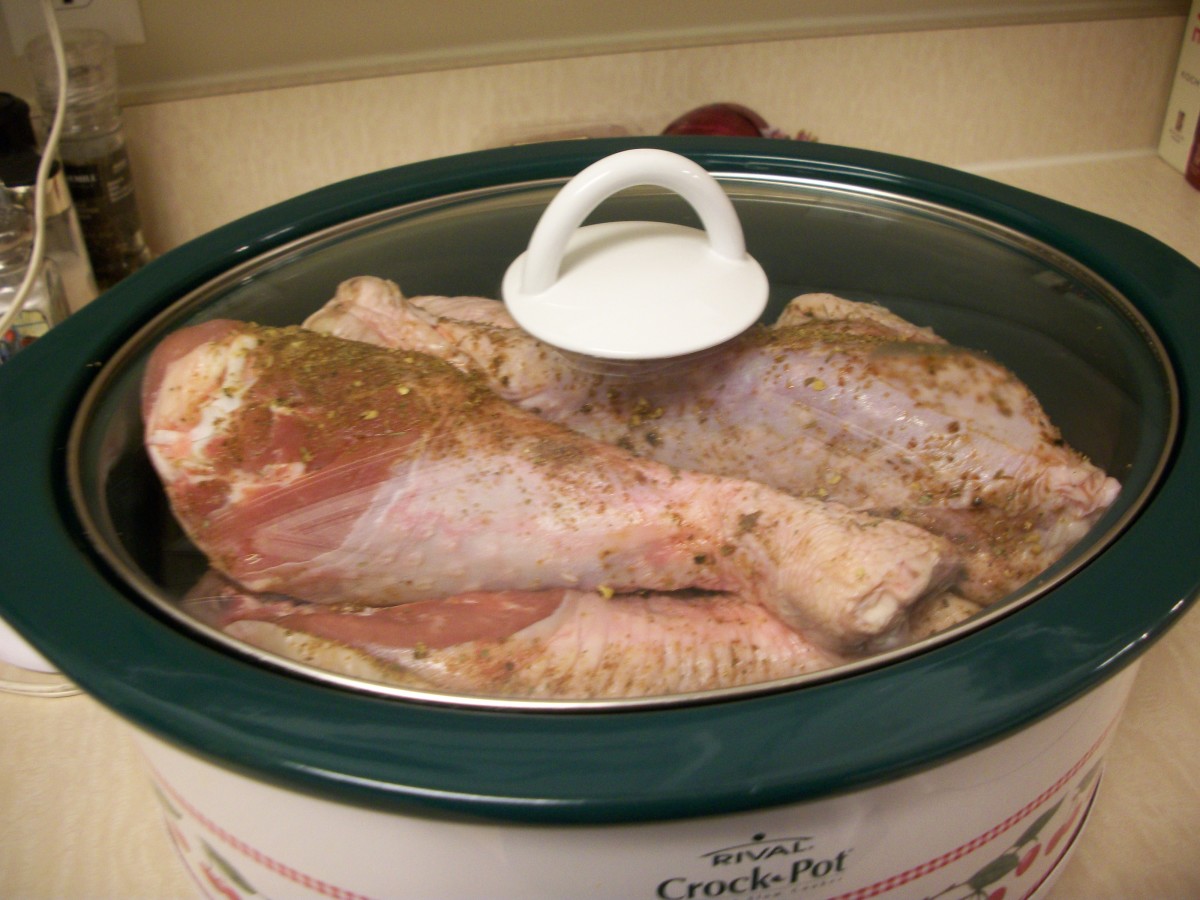 Prepare raw turkey legs with spices and place into the crockpot for about 8-9 hours.