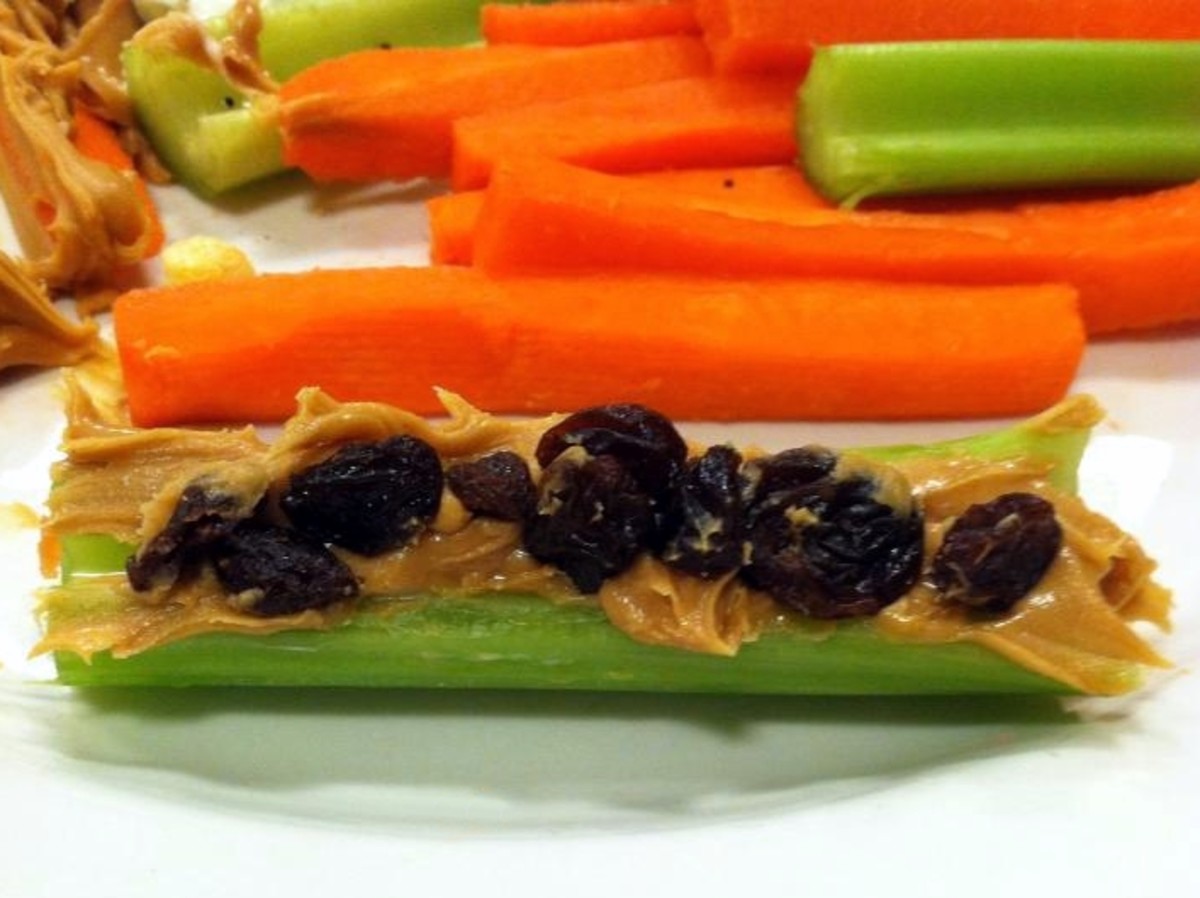 Ants on a Log traditionally uses raisins, but switch to M&Ms for the still healthy but more Halloween-y Bugs on a Log.