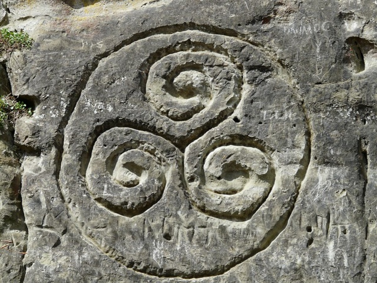 Three was an important number in Celtic mythology and history. This is an ancient Triskelion Symbol carved into stone.