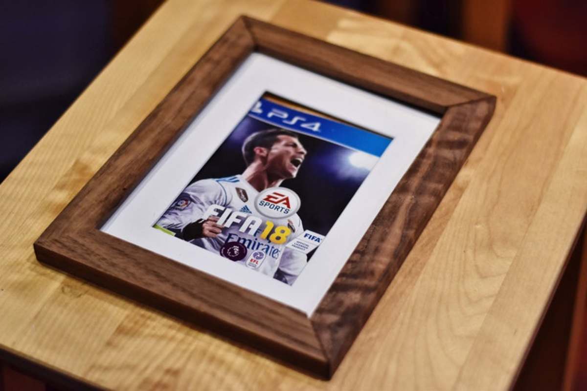 Even if you don't have the perfect photo on-hand, you can still frame something meaningful. Think a favorite t-shirt that no longer fits, an album cover, or even a pair of tickets from an event you attended together. 