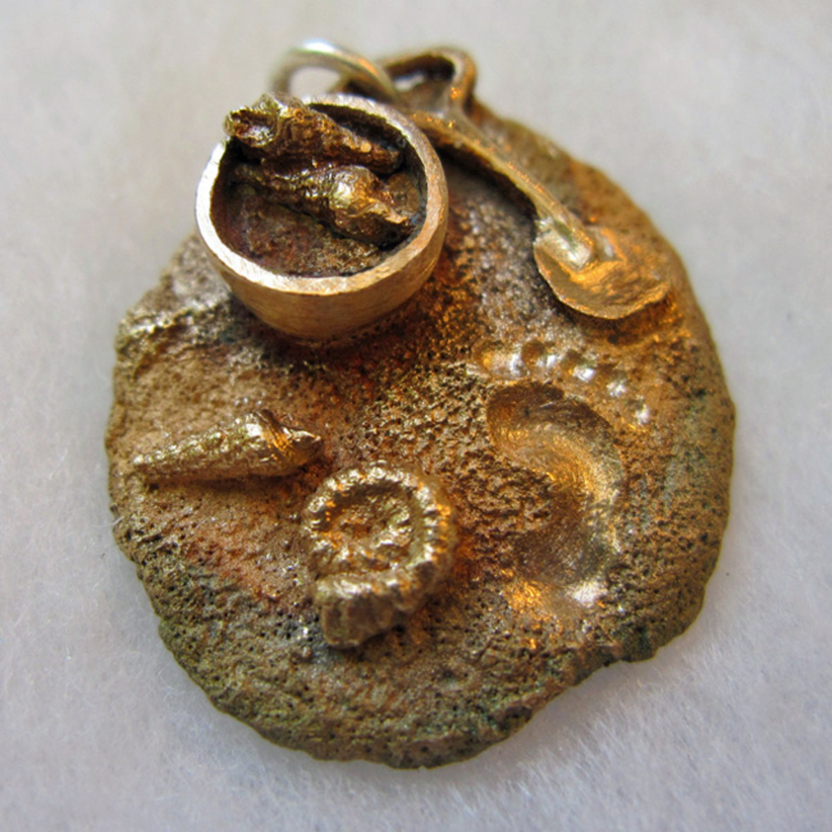 Bronze beach charm made from FASTfire BRONZclay.