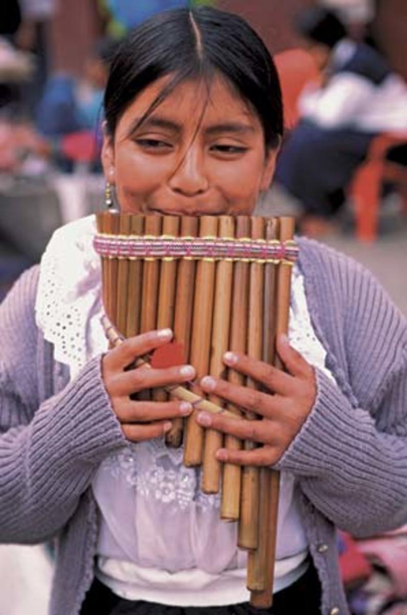 Woman playing the pan pipes