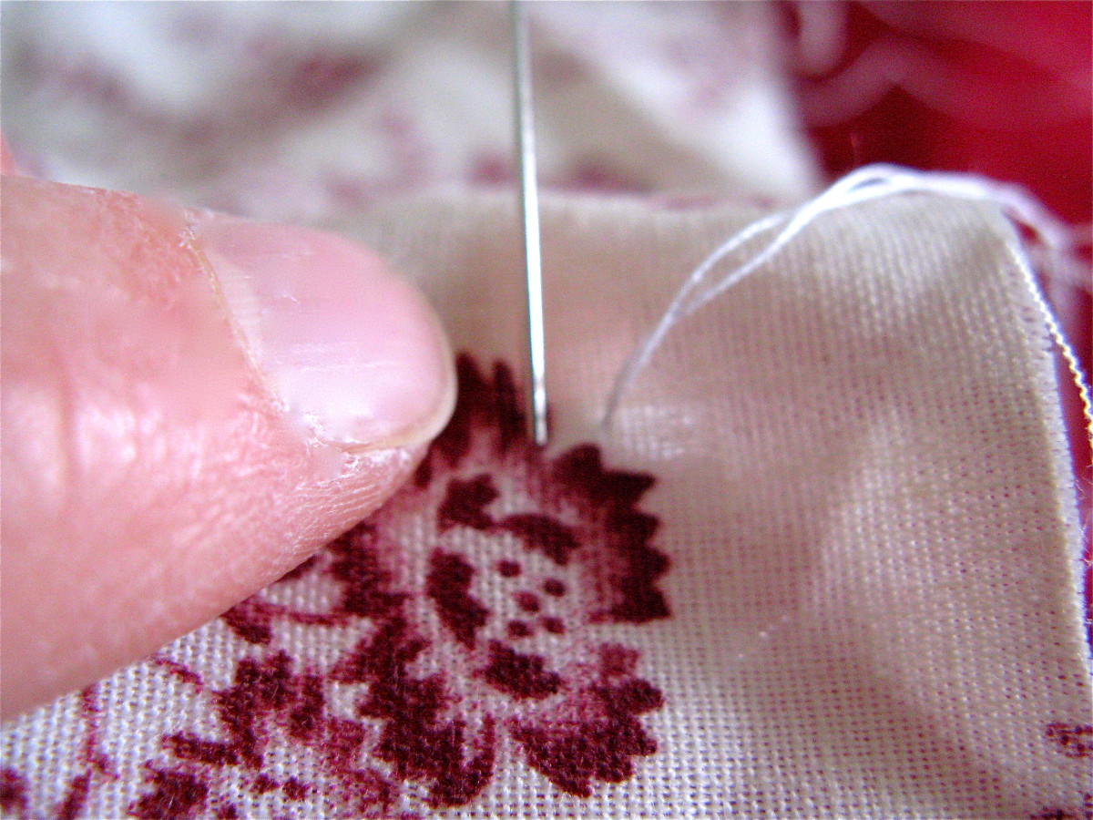 Your next stitch should enter the fabric on the SAME side the thread is coming out of (the right side).
