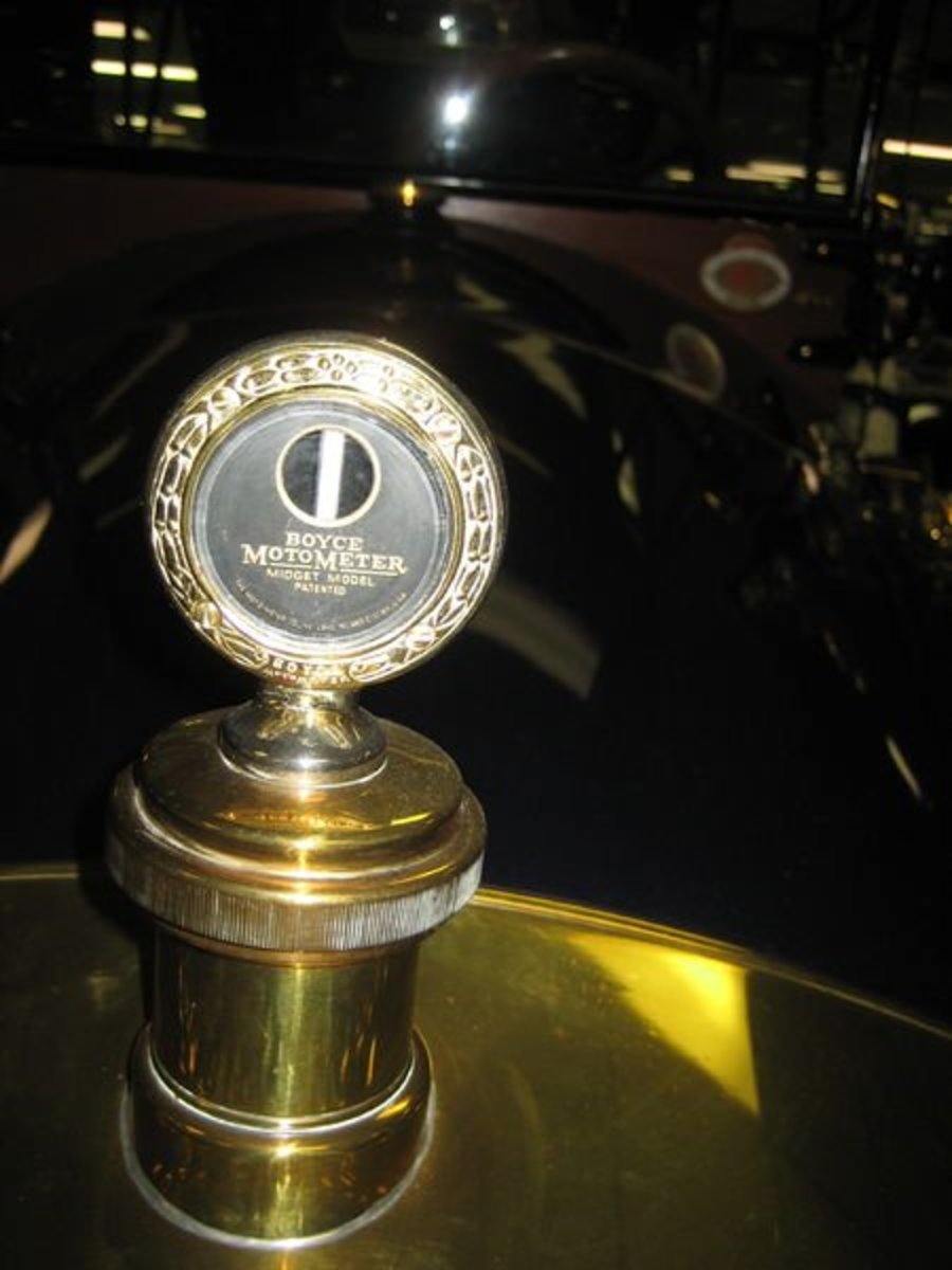 This a metered radiator cap from a Car-Nation automobile in 1913.