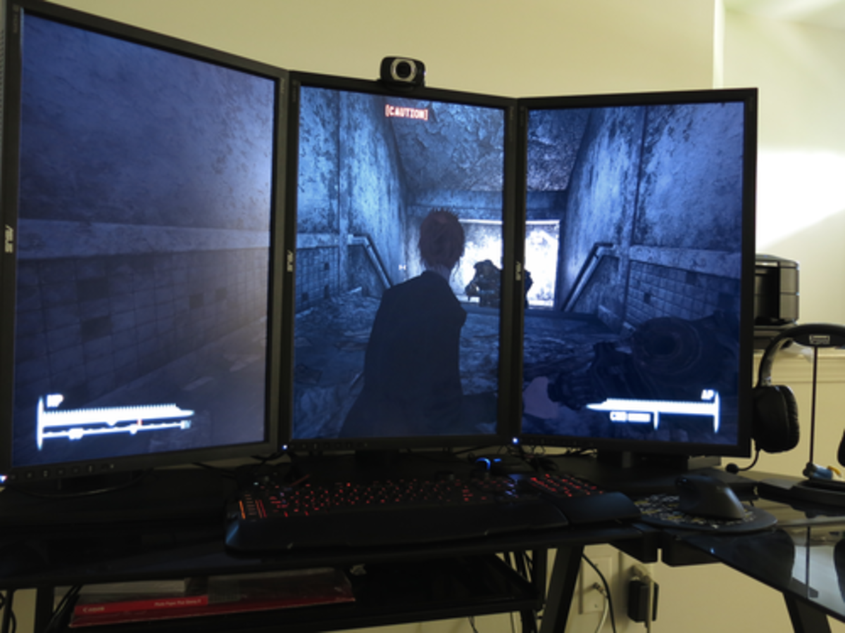The Asus PA248Q in a multi-monitor setup. Turning your monitor vertically may be better for certain jobs.