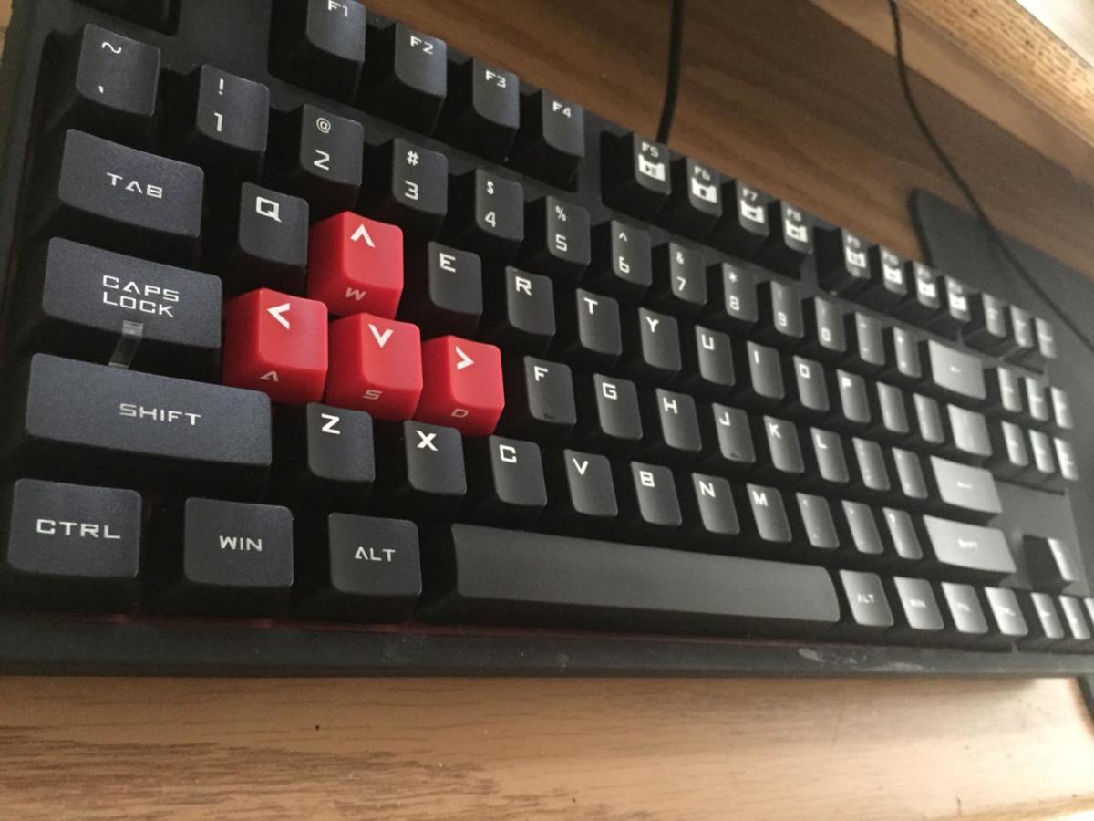 While it wouldn't typically be viewed as an ergonomic keyboard, the CM Storm Quickfire allows you to choose the mechanical keys you want and comes tenkeyless. This allows you to move the mouse closer to the keyboard on the right side. 