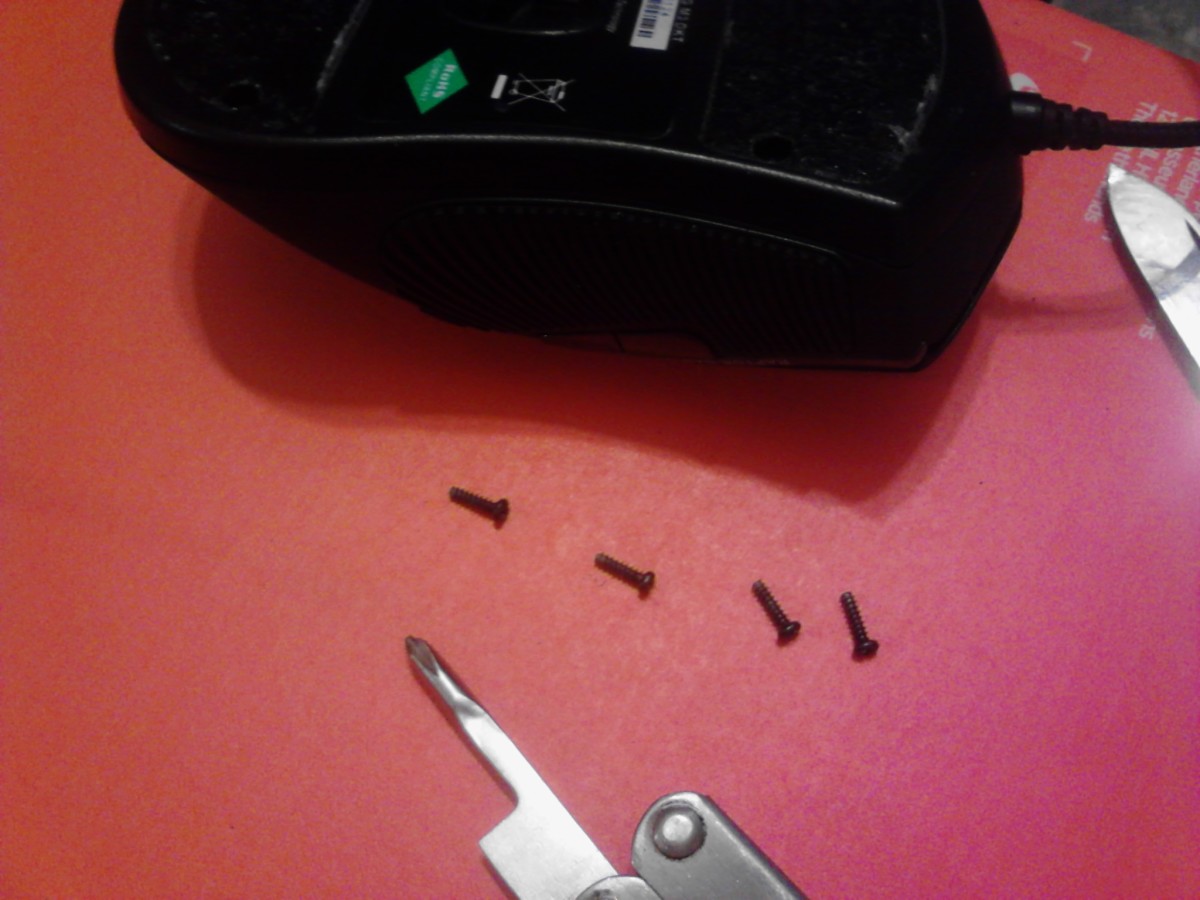 All screws removed to allow opening of mouse. Set aside all small parts in a container so you don't lose them!
