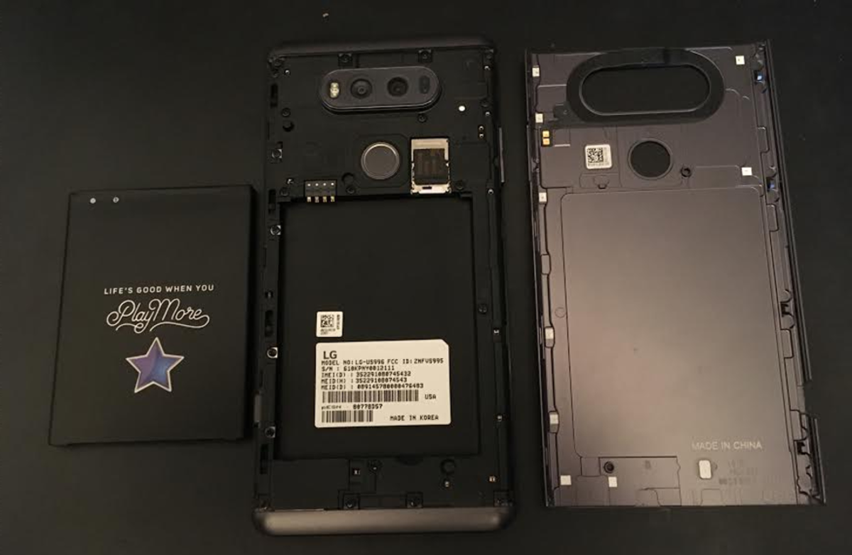 The phone with the back plate off and the battery removed. You can see the SIM card slot and the SD card slot.