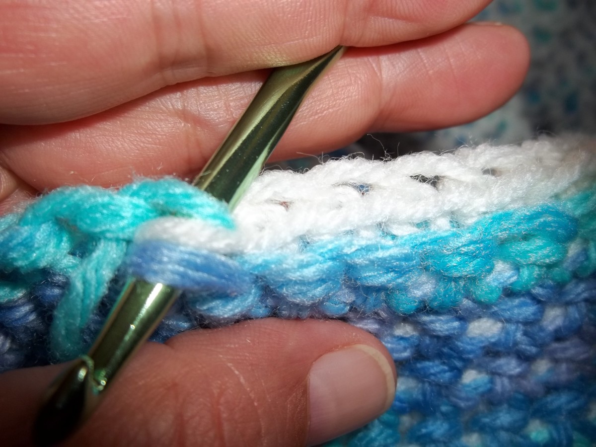 You will be working from the other side. This shows the loops you will pull the yarn through.