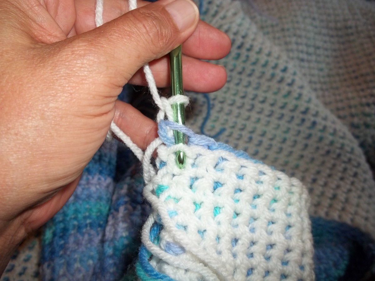 This shows where the first stitch in the row is at. You will be working from the other side.