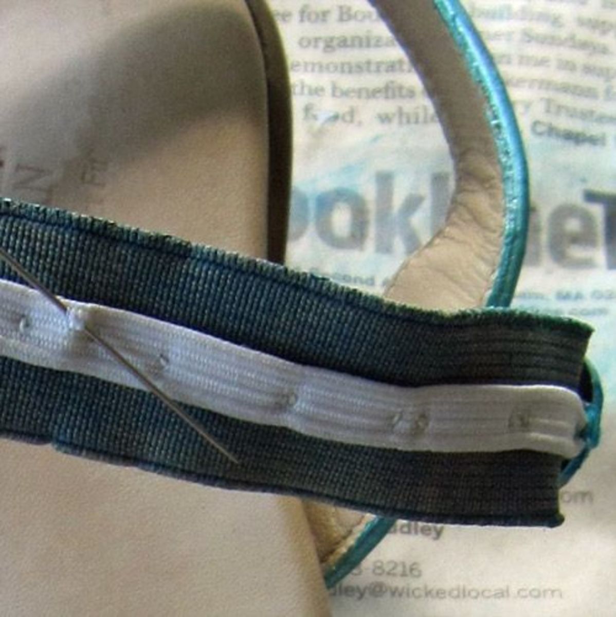 Reinforcing the stretched-out elastic strap with strong, thin elastic. Photo by Margaret Schindel, all rights reserved.