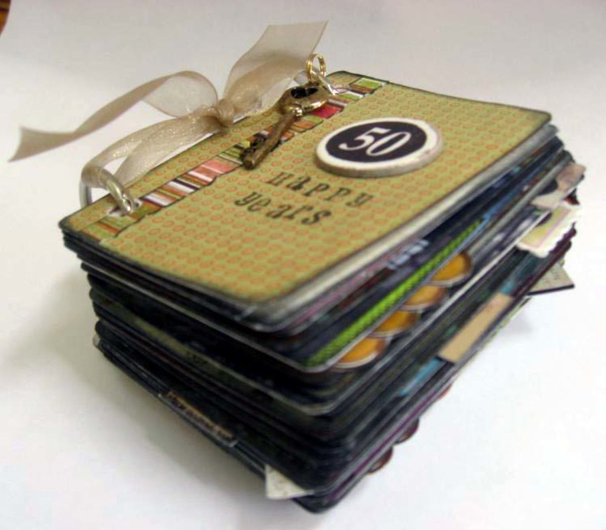 Miniature art book made from a deck of playing cards.