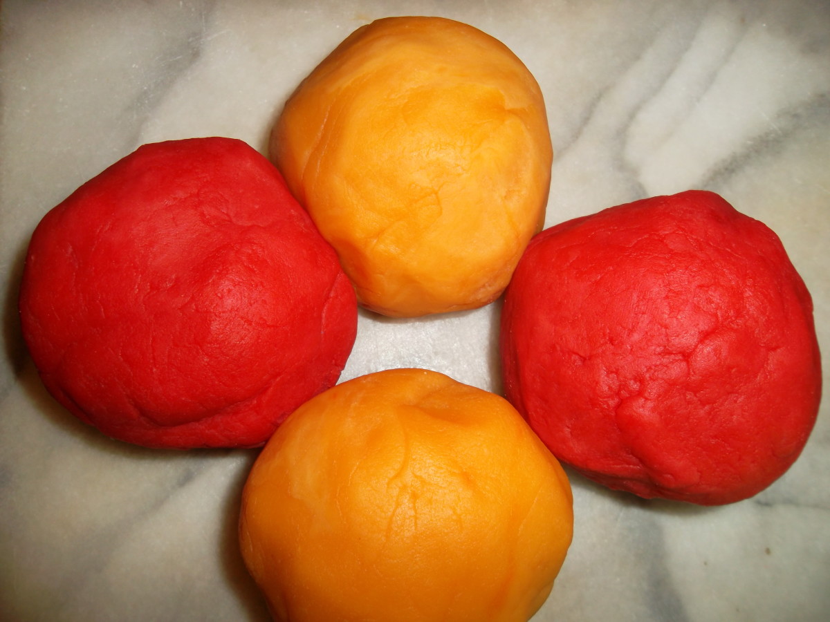 This playdough was made with orange and strawberry Kool-Aid.