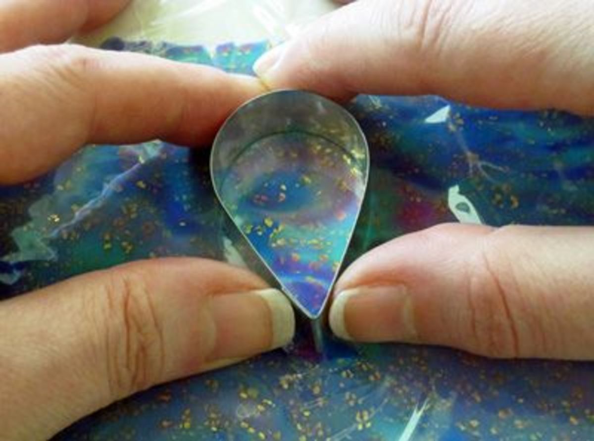 Use the cutter as a frame to select the desired section of the pattern for the cabochon
