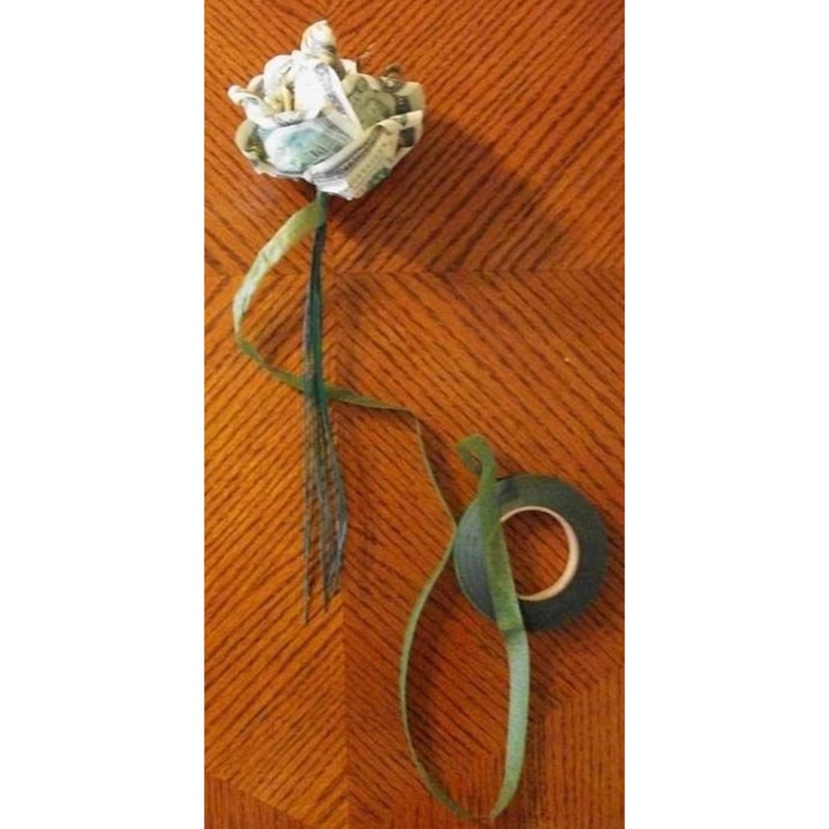 Step 7: Be sure to pull the floral tape tight as you wrap it around the wires to help it stick to itself.