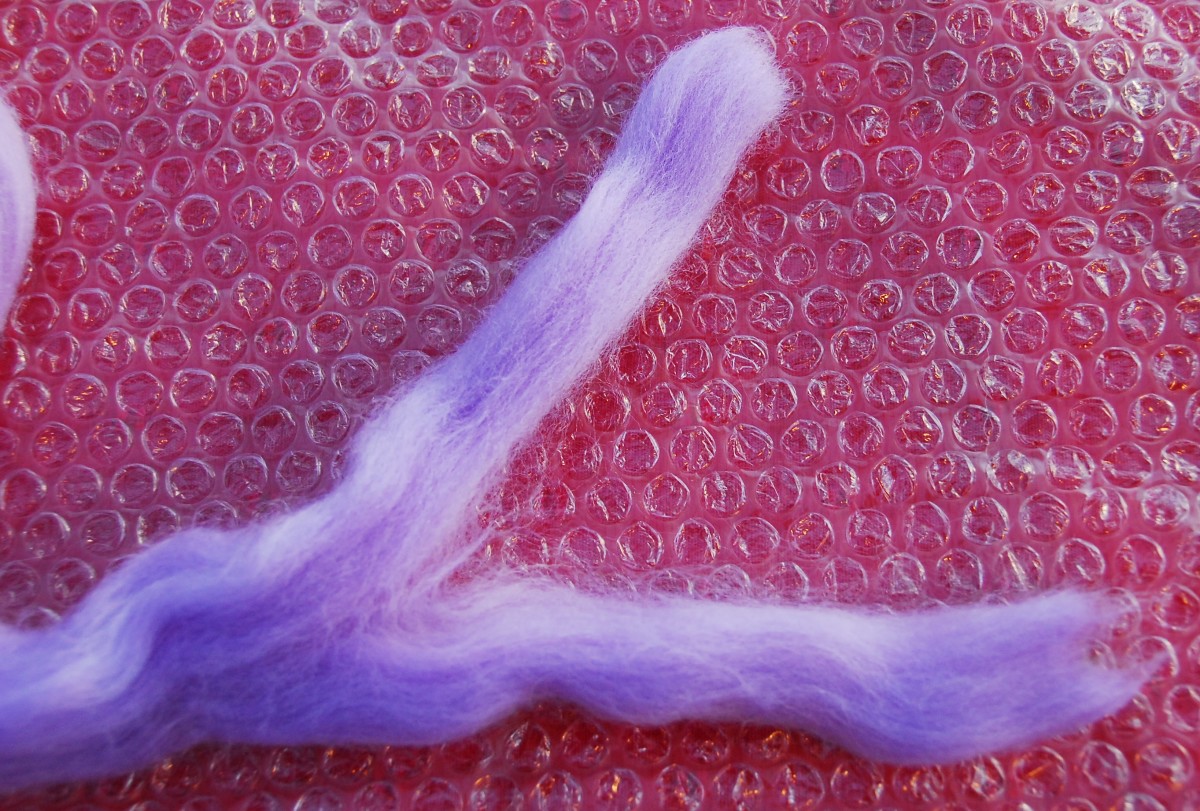 You may want to split your roving to make it easier to pluck the fibre from the roving when you make your layers
